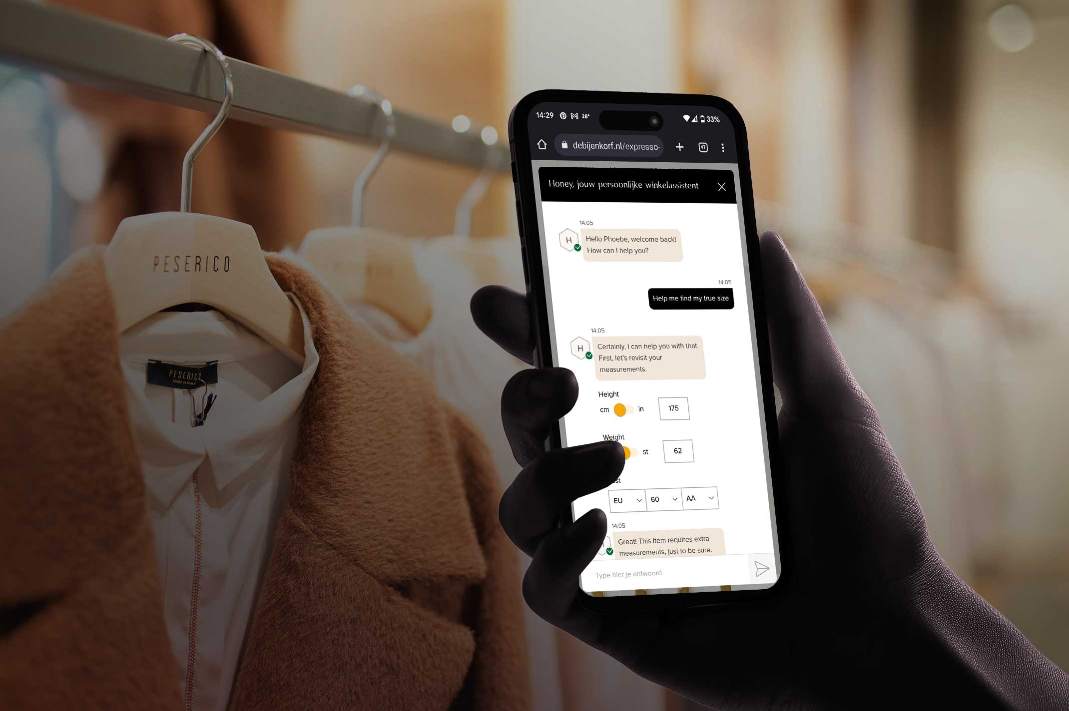 A hand holding a smartphone displaying a chat with Honey, the AI personal assistant of the online store De Bijenkorf.